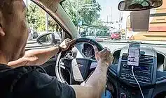 Touching Your Phone in a Car Mount: UK Lawyer Explains the Law Touching Your Phone in a Car Mount: UK Lawyer Explains the Law
